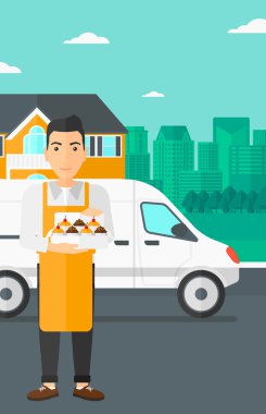 Baker 'ın elinde bir kutu pasta..