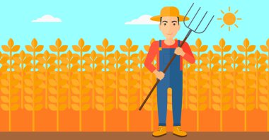 Çiftçi dirgen ile.