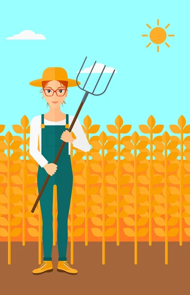 Agricultor con horquilla . — Vector de stock