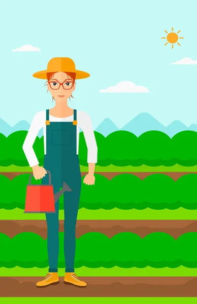 Agriculteur avec arrosoir. — Image vectorielle