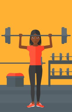 Kadın halter kaldırıyor..