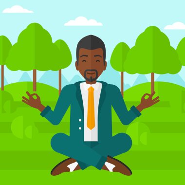 Lotus pozisyonunda meditasyon yapan iş adamı..