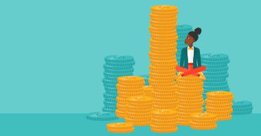 Business woman sitting on gold.