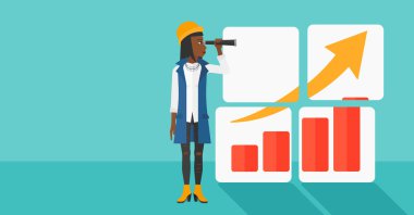 Woman looking at positive bar chart.