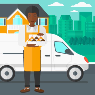 Baker 'ın elinde bir kutu pasta..