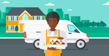 Baker 'ın elinde bir kutu pasta..