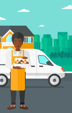 Baker 'ın elinde bir kutu pasta..