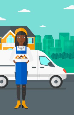 Baker 'ın elinde bir kutu pasta..