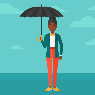 Business woman standing with umbrella.