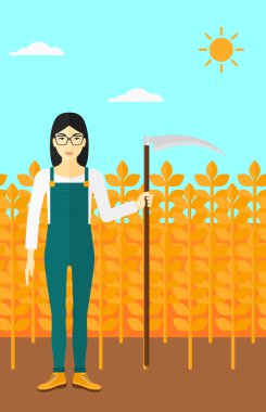 Çiftçi tırpan ile sahada.