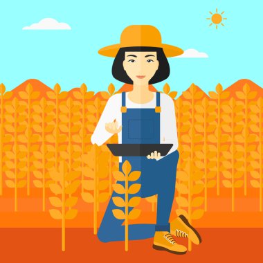 Tablet bilgisayarda alan ile çiftçi.