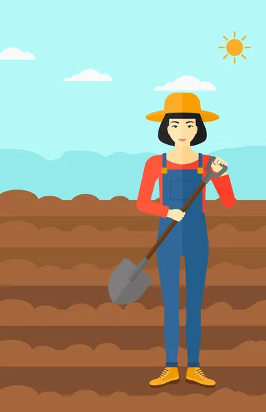 Agricultor en el campo con pala . — Vector de stock