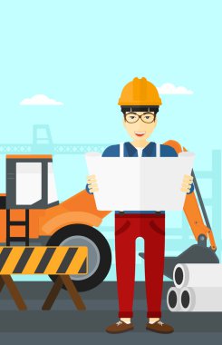 Bir plan tutan mühendisi.