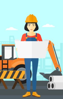 Bir plan tutan mühendisi.