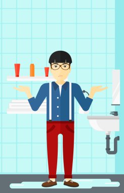 Adam umutsuzluk ayakta sızdıran lavabo yakınındaki.