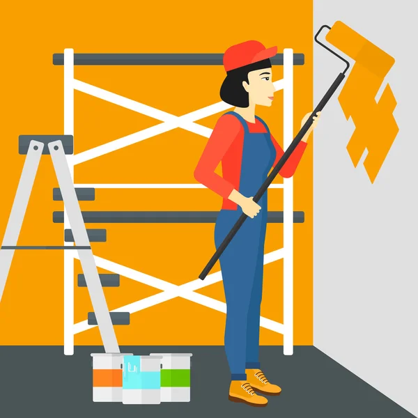 Pintor con rodillo de pintura . — Vector de stock