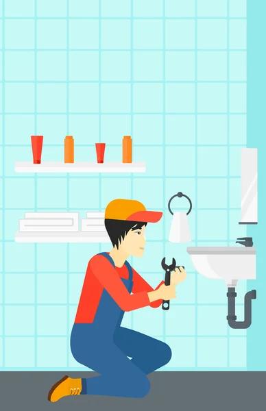 Hombre reparando fregadero . — Vector de stock