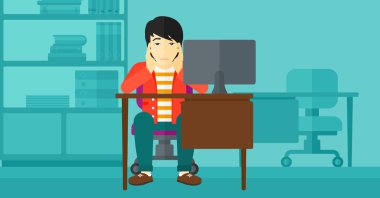 Tired employee sitting in office.