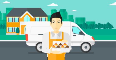 Baker 'ın elinde bir kutu pasta..