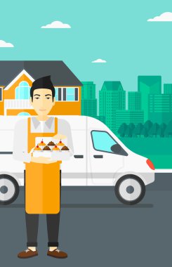 Baker 'ın elinde bir kutu pasta..