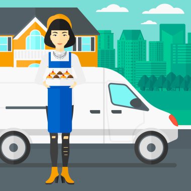 Baker 'ın elinde bir kutu pasta..