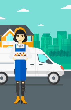 Baker 'ın elinde bir kutu pasta..