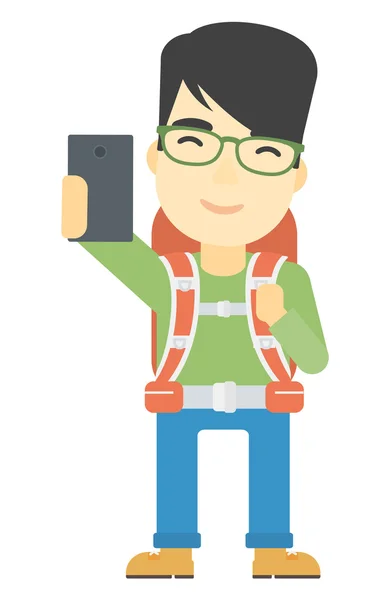 Backpckaer haciendo selfie . — Vector de stock