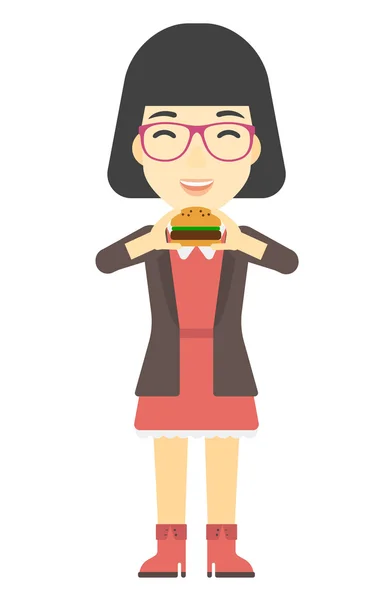 Eszik hamburgert nő. — Stock Vector
