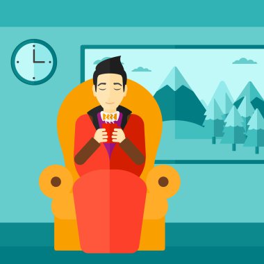 Çay sandalyeyle içinde oturan adam.