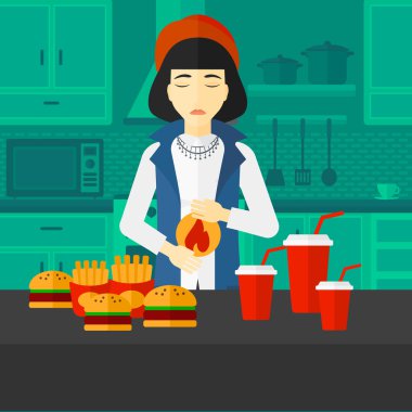 Mide ekşimesi muzdarip kadın.