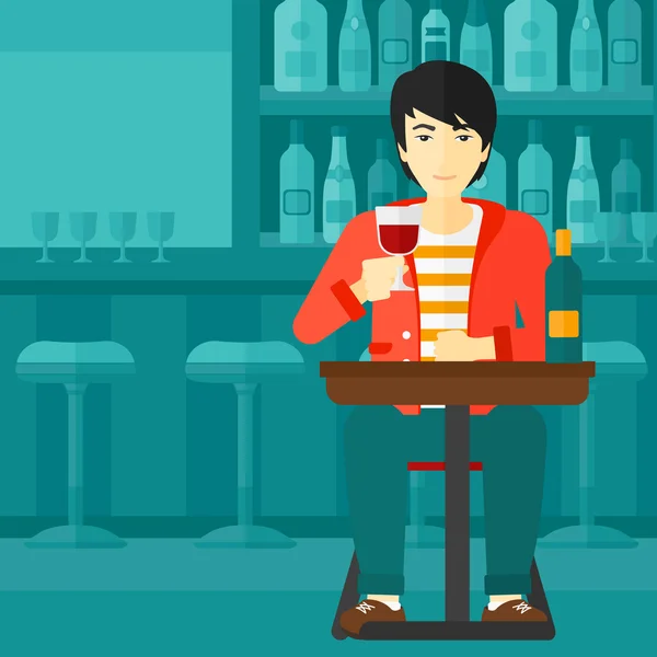 Hombre sentado en el bar . — Vector de stock