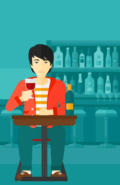 Hombre sentado en el bar . — Vector de stock