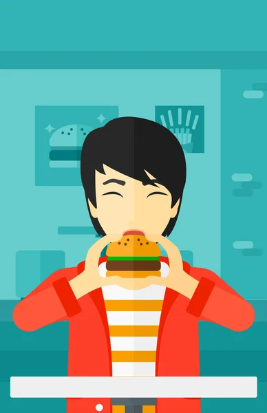 男子吃汉堡包. — 图库矢量图片
