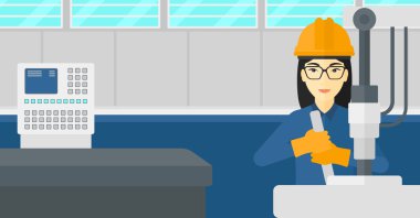 Endüstri/sanayii donatımı ile çalışan kadın.