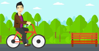 Bisiklete binen adam.