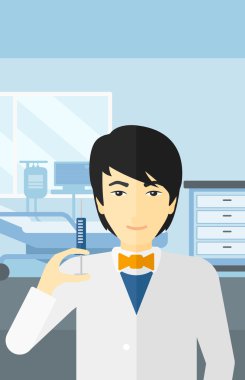 Doktor hastane koğuşunda şırınga.