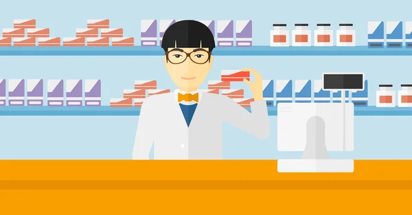 Farmacéutico mostrando algún medicamento . — Vector de stock