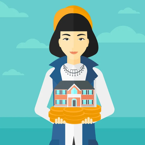 Mujer holding casa modelo . — Vector de stock
