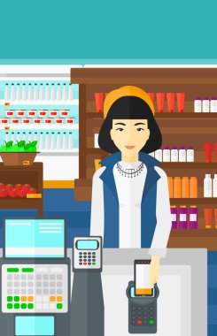 Customer paying with his smartphone using terminal.