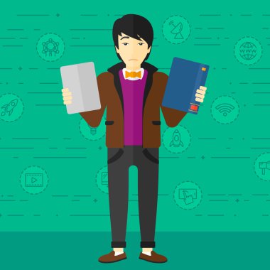 Man choosing between book and tablet computer.