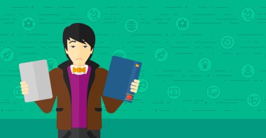 Man choosing between book and tablet computer.