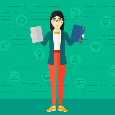 Woman choosing between book and tablet computer.