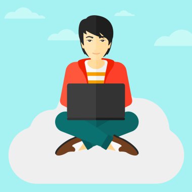 Dizüstü bilgisayarda çalışan adam.