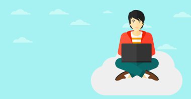 Dizüstü bilgisayarda çalışan adam.