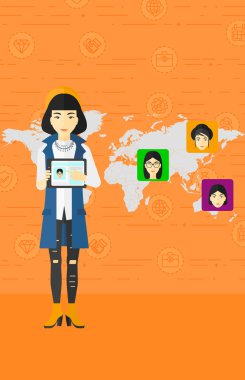 Woman holding tablet computer with social media source.