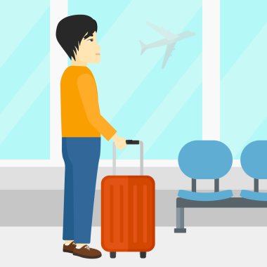 adam havaalanında bavul ile.