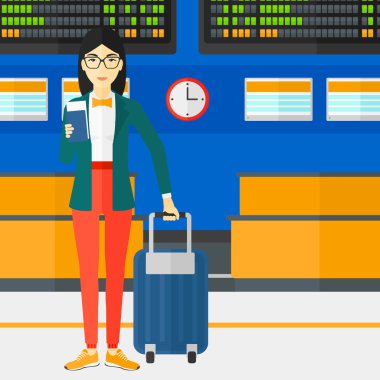 Bavulla ayakta ve bileti kadın.