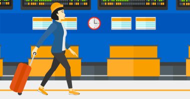 Kadın bavulla yürüyor..