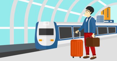 Man with suitcase on wheels and briefcase.