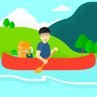 Man canoeing on the river.